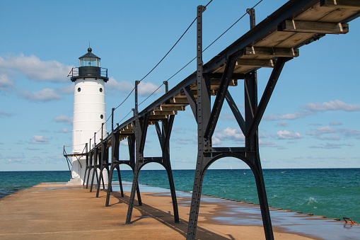 Image of a pier with lighthouse on lake Michigan
